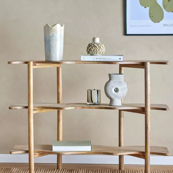 Bookcase made of mango wood in natural color with wavy shelves