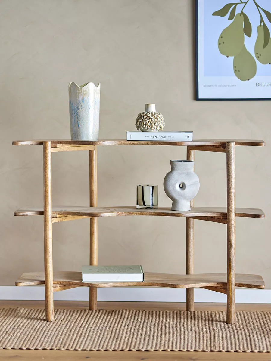 Bookcase made of mango wood in natural color with wavy shelves