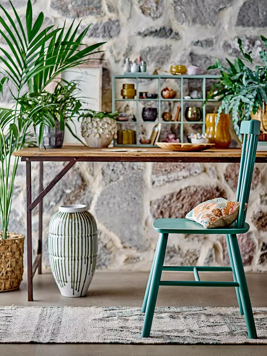 Loft dining table made of reclaimed wood with foldable legs